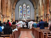 Church Leaders around a candle of unity.jpg